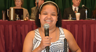 Nefertiti, a previous scholarship winner and member of the NFB of New York, addresses the national convention.